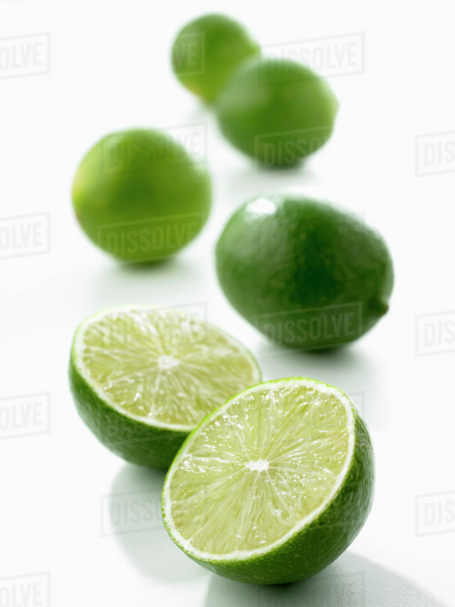 Limes, one halved Stock Photo Dissolve
