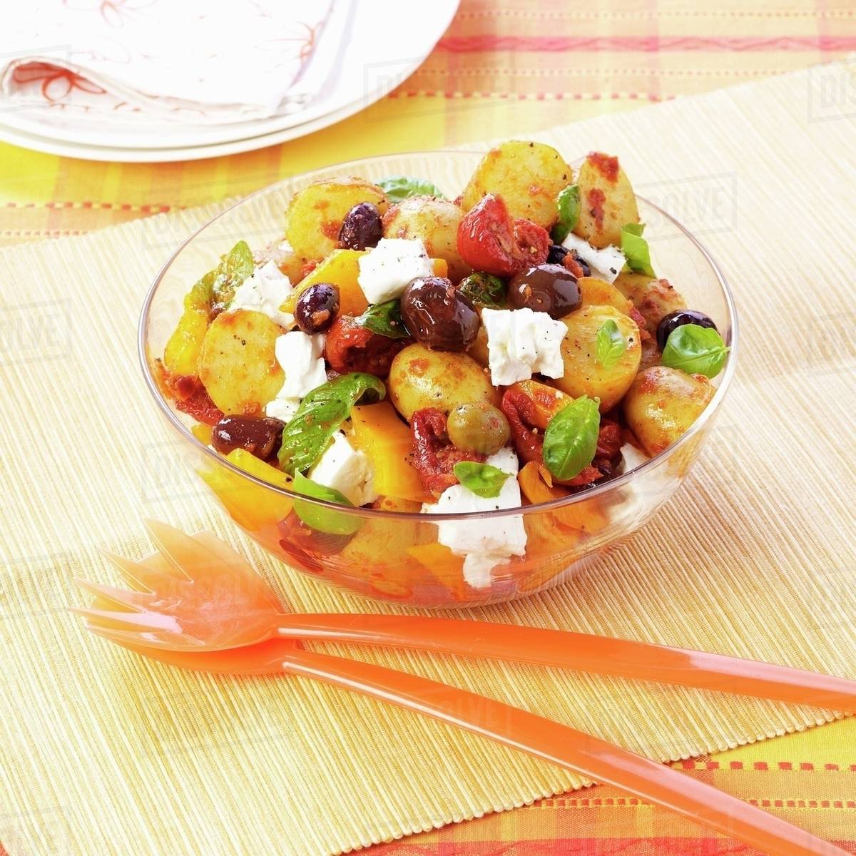 Mediterranean potato salad with olives and feta - Stock Photo - Dissolve