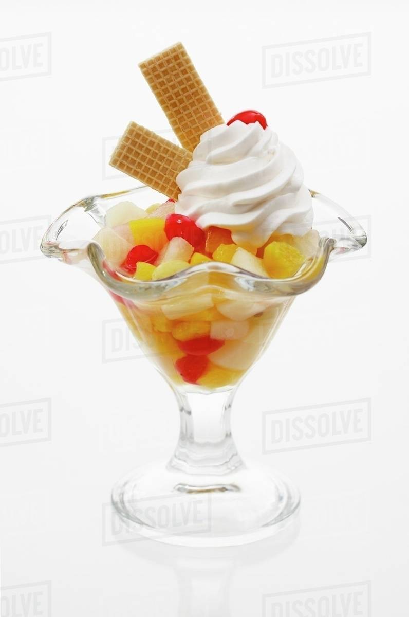 Fruit cocktail with cream Stock Photo Dissolve