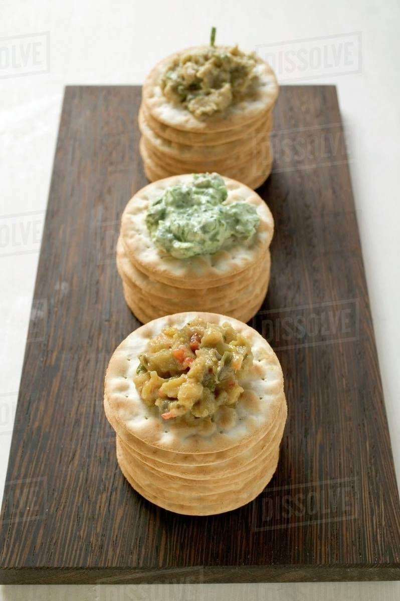 Crackers with three different spreads Stock Photo Dissolve