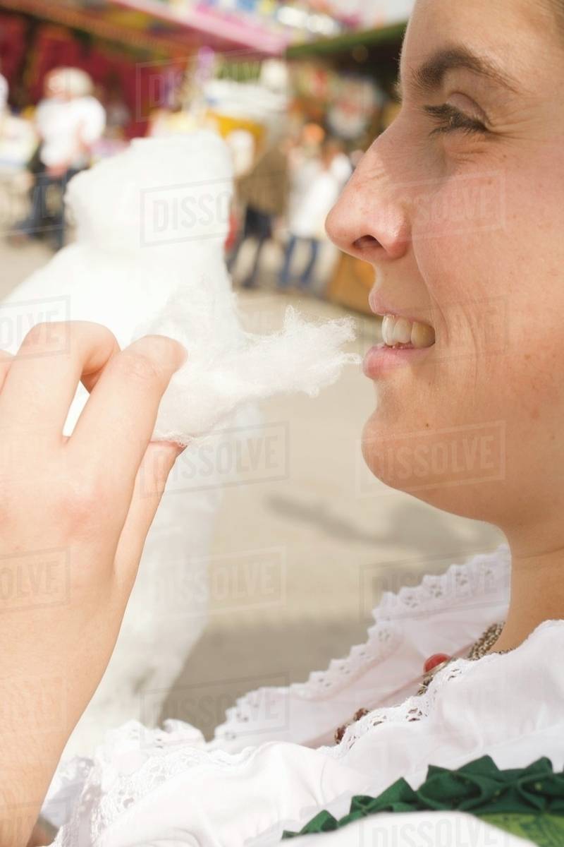 Woman eating candyfloss (Oktoberfest, Munich) Royalty-free stock photo