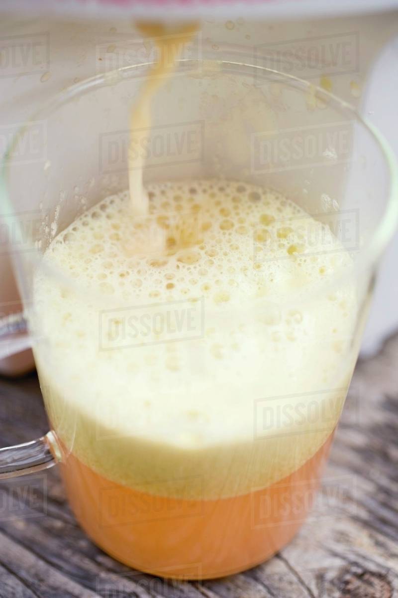 Pressing apple juice Stock Photo Dissolve