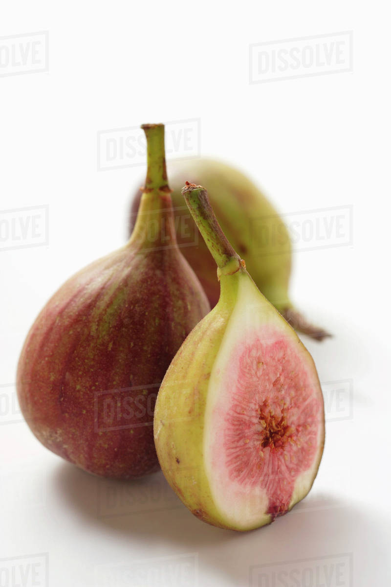 Whole figs and half a fig Stock Photo Dissolve