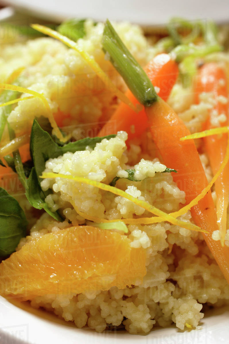 Couscous with carrots and oranges (closeup) Stock Photo Dissolve