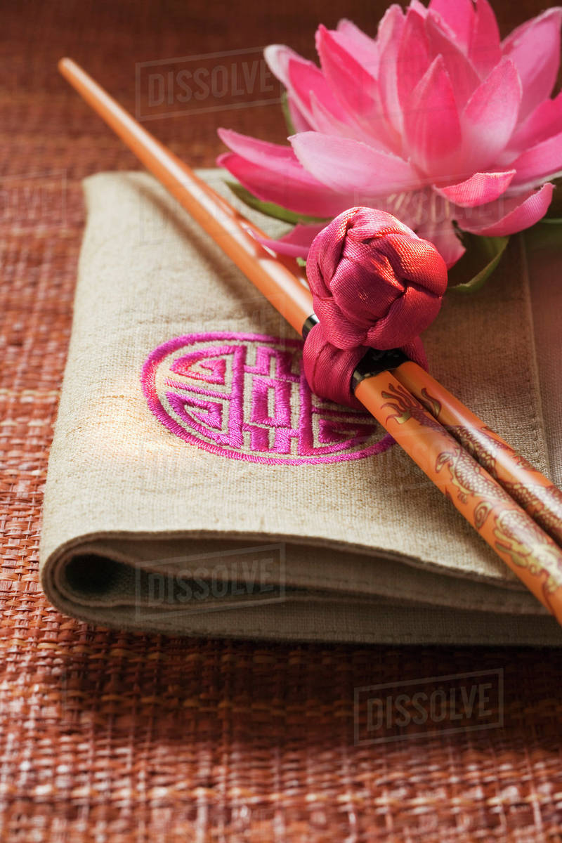 Chopsticks on fabric napkin (Asia) Stock Photo Dissolve