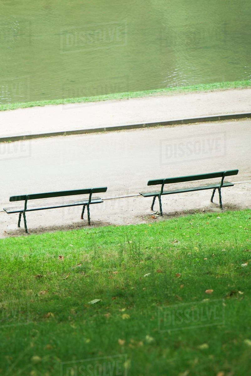 France, Paris, benches facing water in park - Stock Photo - Dissolve