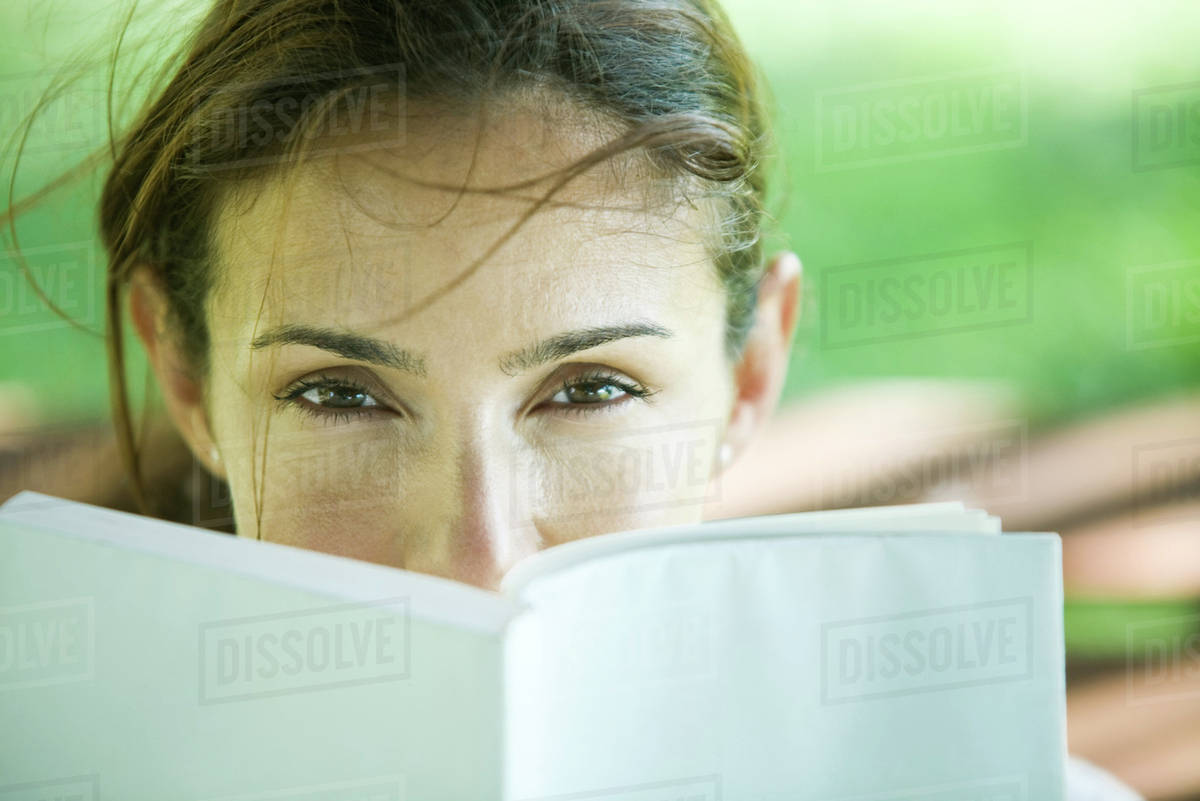 Woman looking over book Royalty-free stock photo