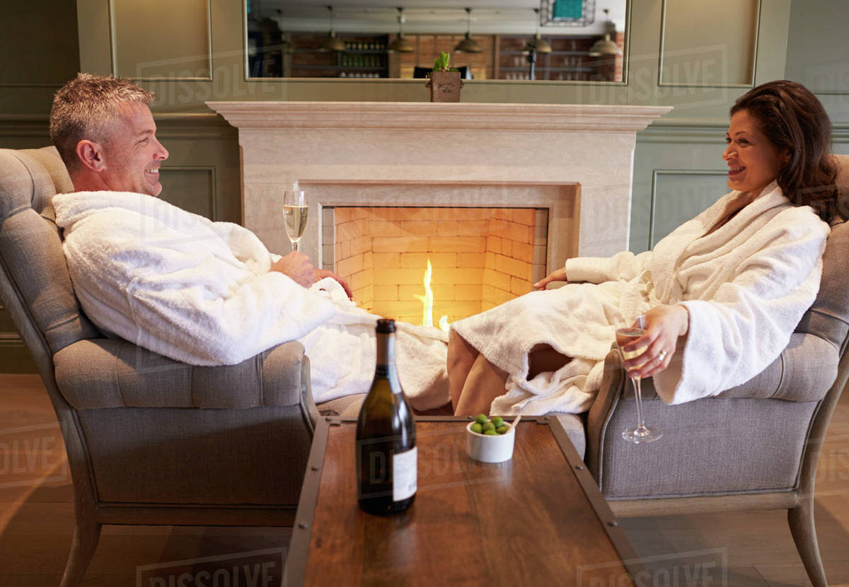Couple wearing robes relaxing on hotel spa break Stock Photo Dissolve