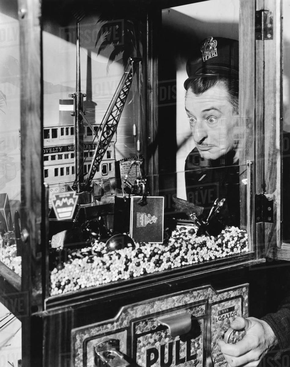 Policeman trying to catch a toy Stock Photo Dissolve