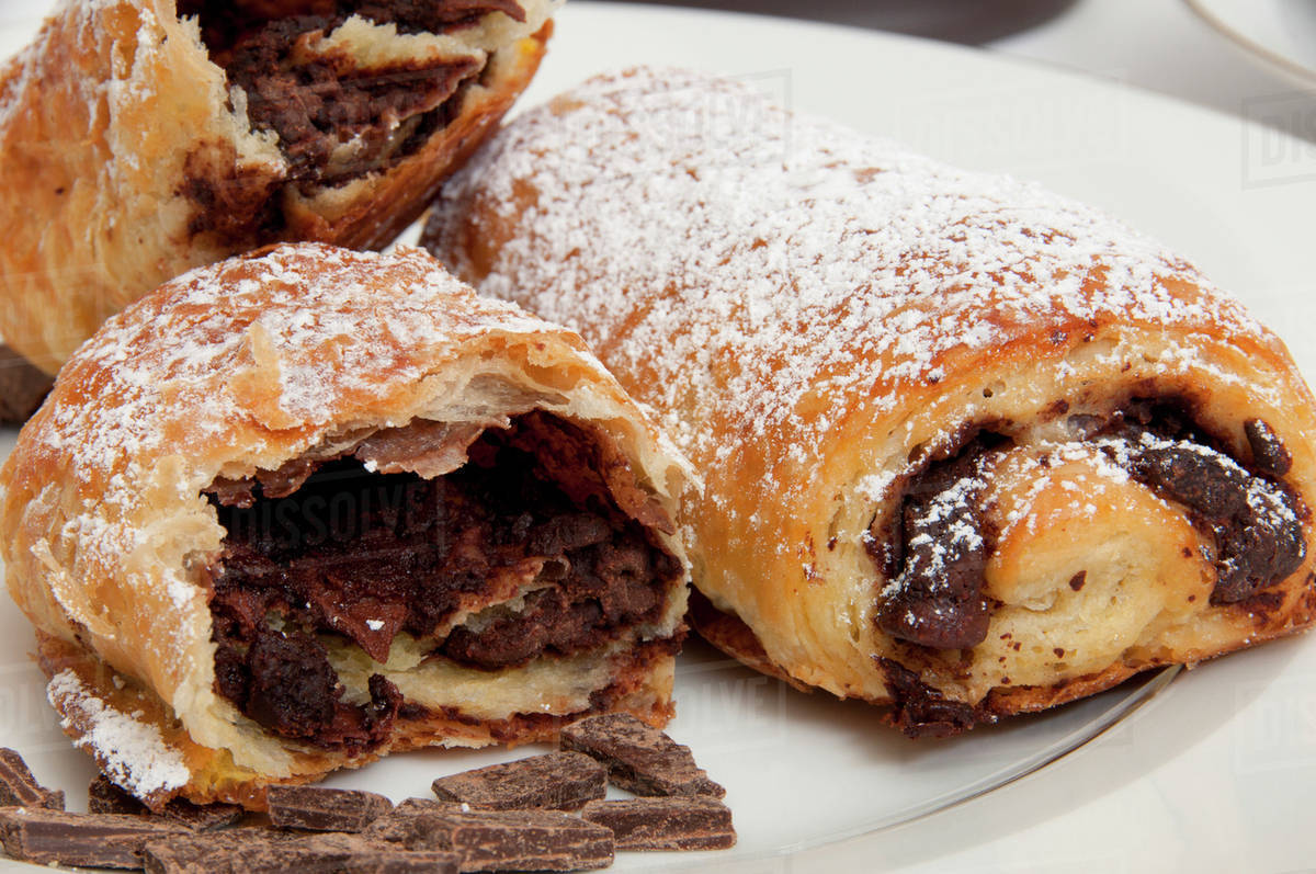 Powdered sugar on chocolate croissants Stock Photo Dissolve