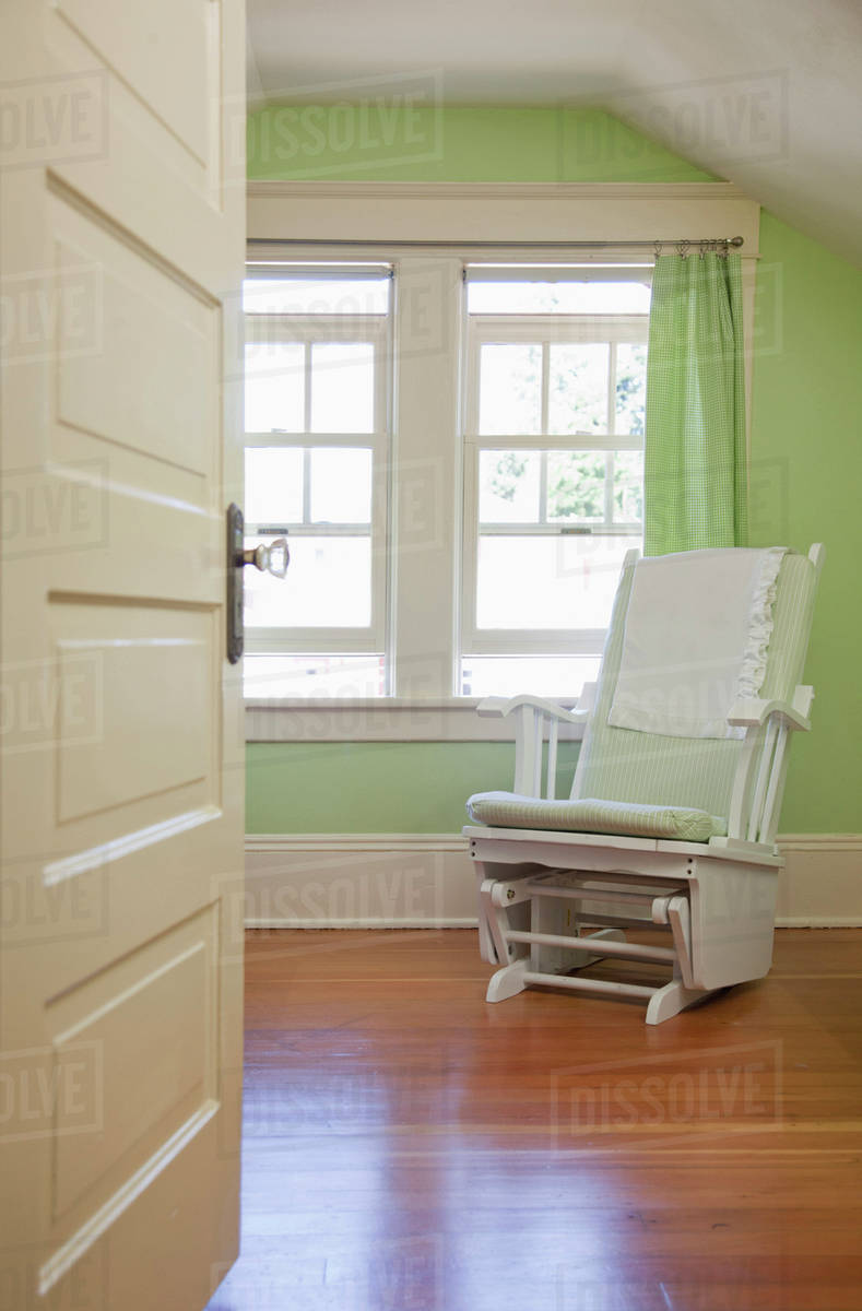 Rocking chair in nursery bedroom Stock Photo Dissolve