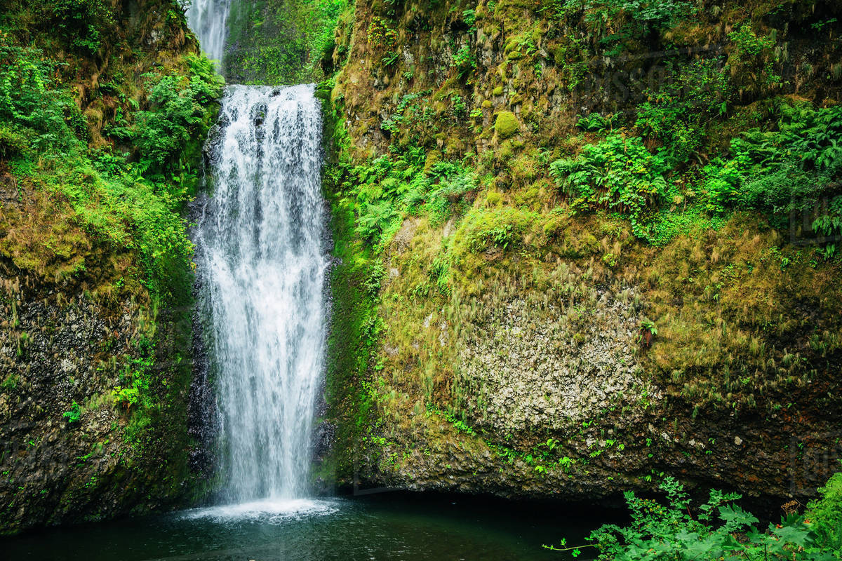 Multnomah Falls over rocky hillside, Portland, Oregon, United States