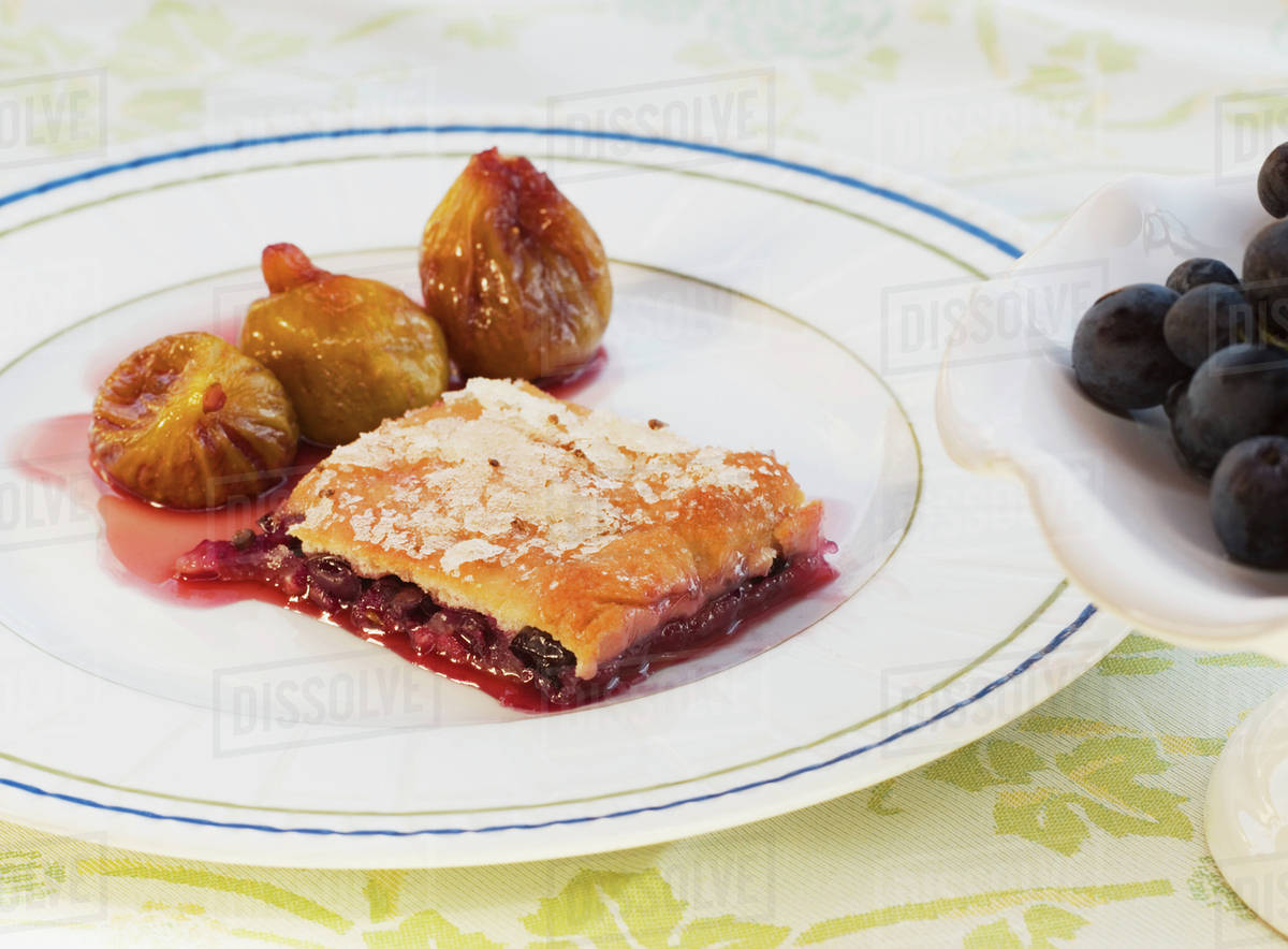 Crostata of fresh grapes with stewed figs Stock Photo Dissolve