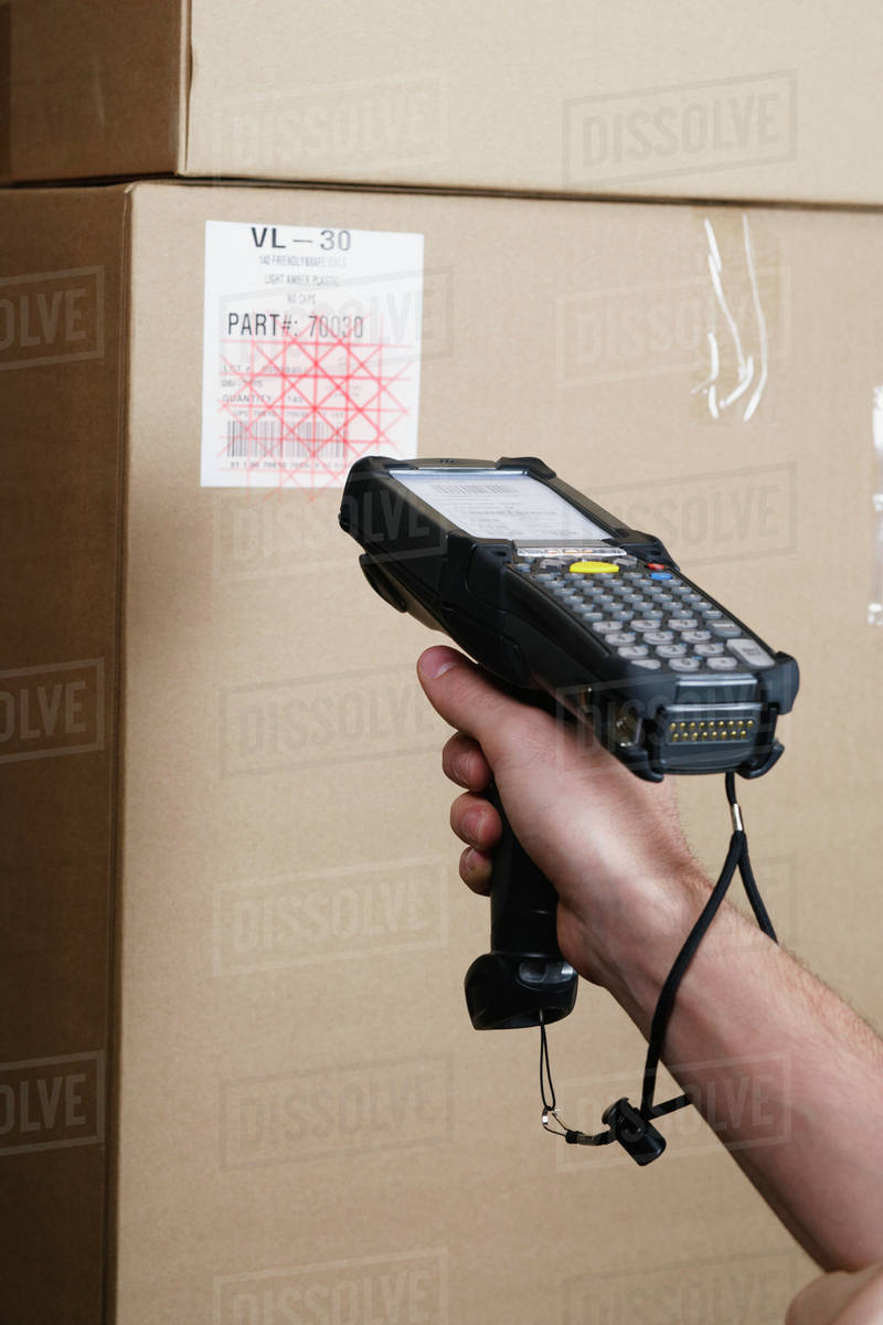 Close up of scanner gun scanning package Stock Photo Dissolve