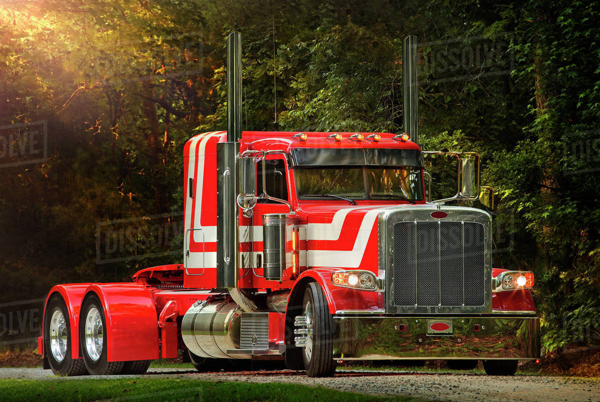 Semitruck driving on dirt road Stock Photo Dissolve