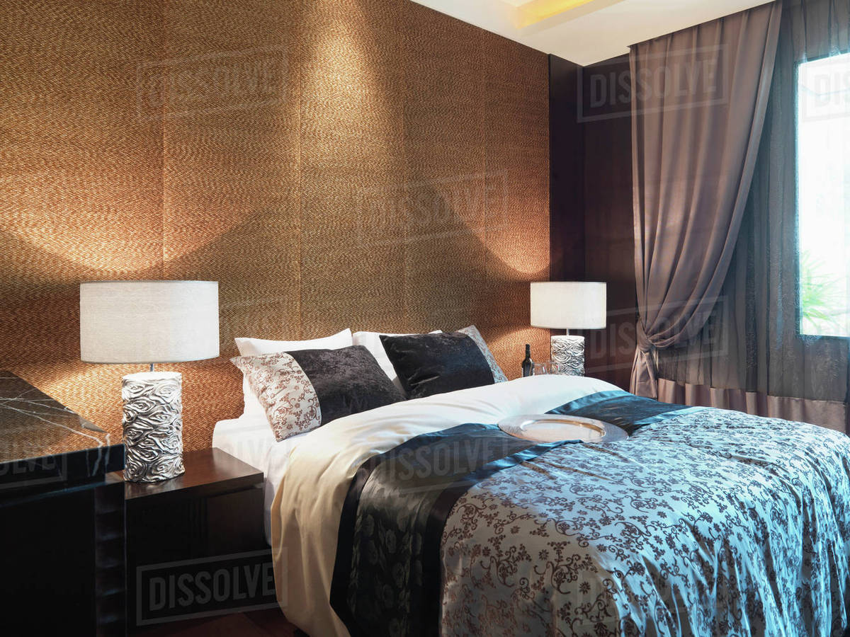 Textured wall behind bed Stock Photo Dissolve