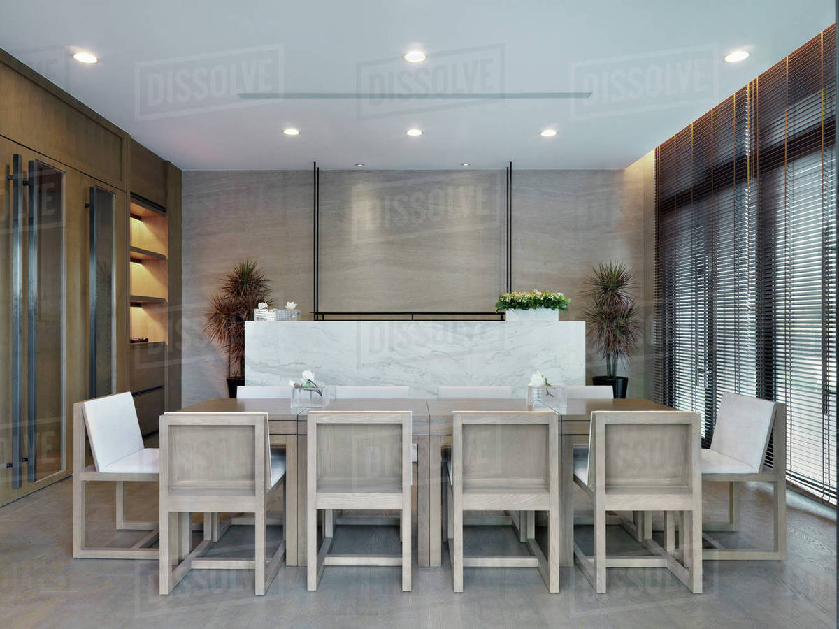 Modern wooden dining room table Stock Photo Dissolve