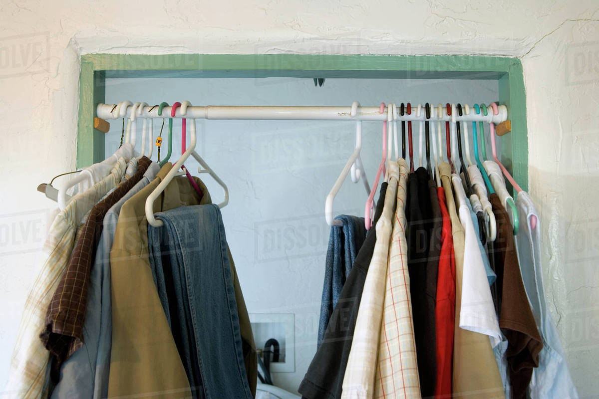 Curtain Rod In Doorway With Hanging Clothes Stock Photo Dissolve Curtain Rod In Doorway With Hanging Clothes