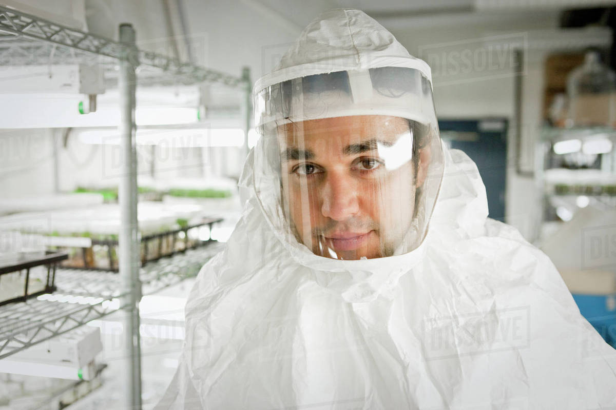 Middle Eastern scientist in clean suit in laboratory Stock Photo