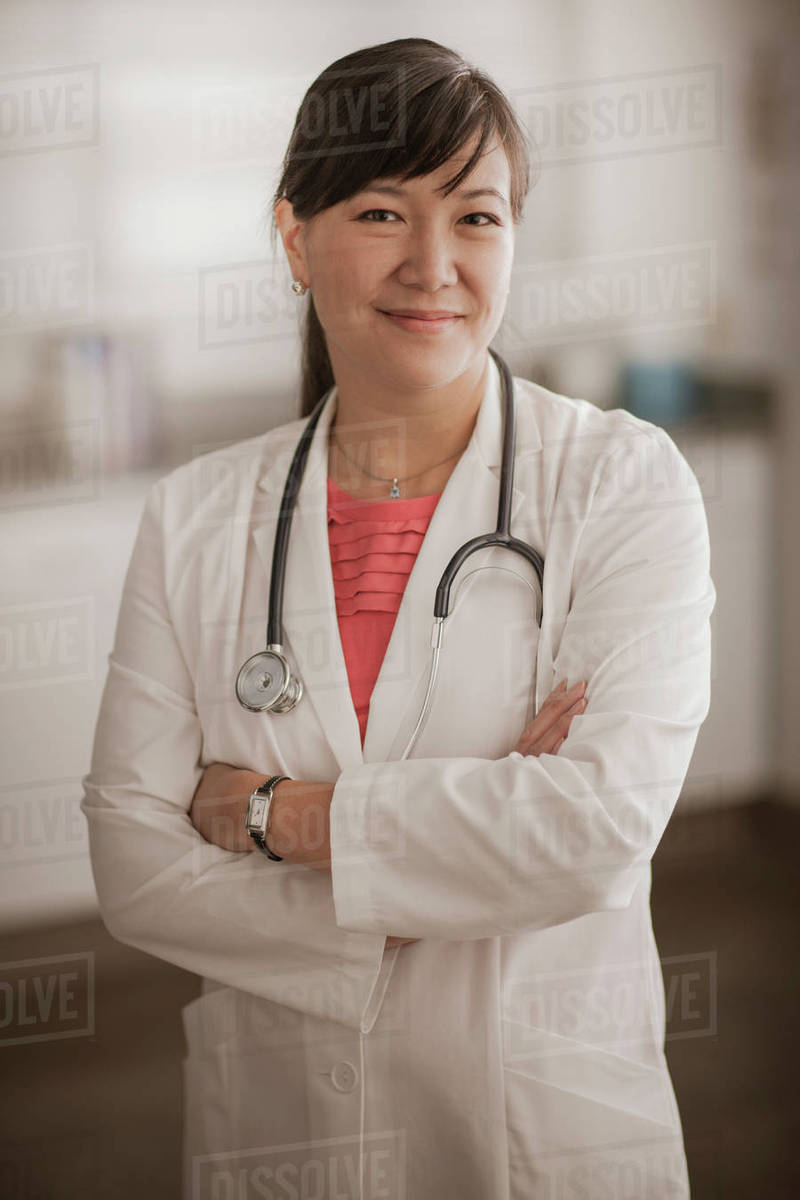 Smiling Chinese doctor Stock Photo Dissolve