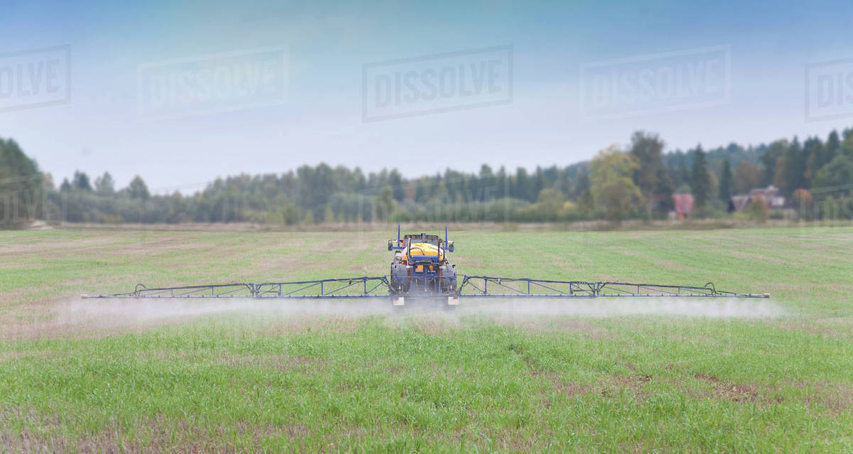 Tractor Spraying Herbicide Stock Photo Dissolve