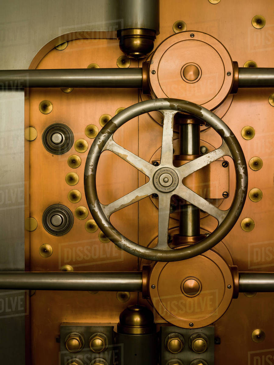 Tumbler on a Vault Door Stock Photo Dissolve