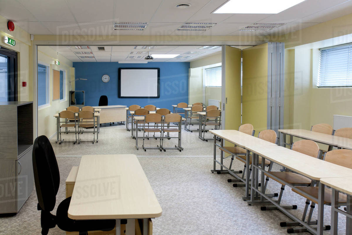 a-large-room-with-tables-and-chairs-stock-photo-dissolve