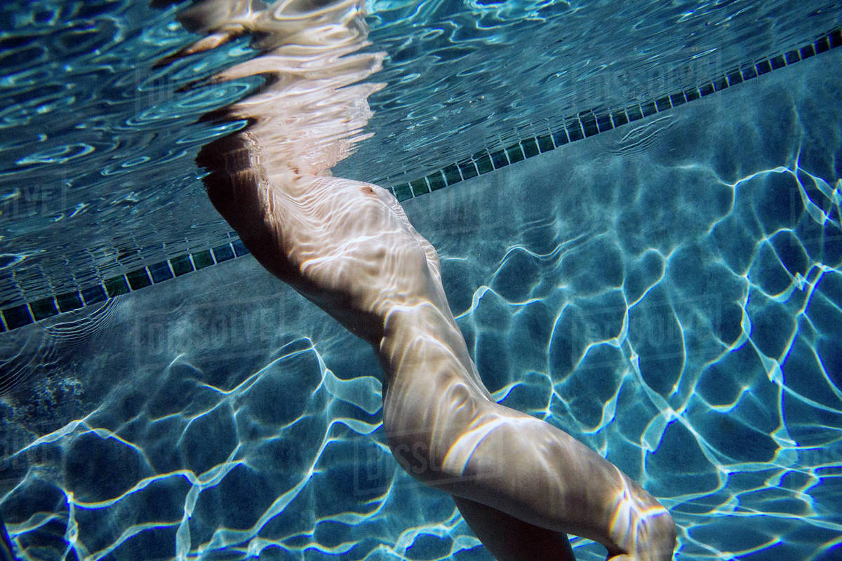 Naked Caucasian woman swimming underwater Royalty-free stock photo