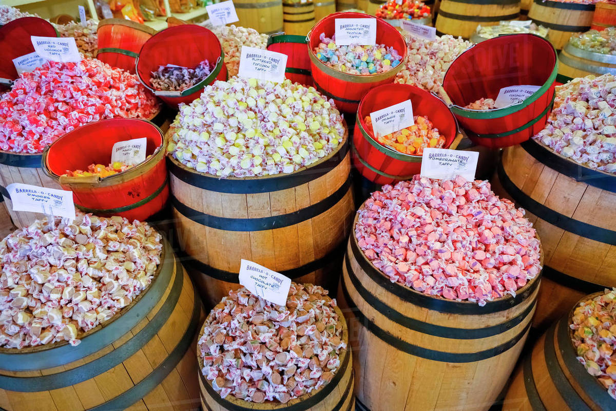 Barrels of taffy in store Stock Photo Dissolve