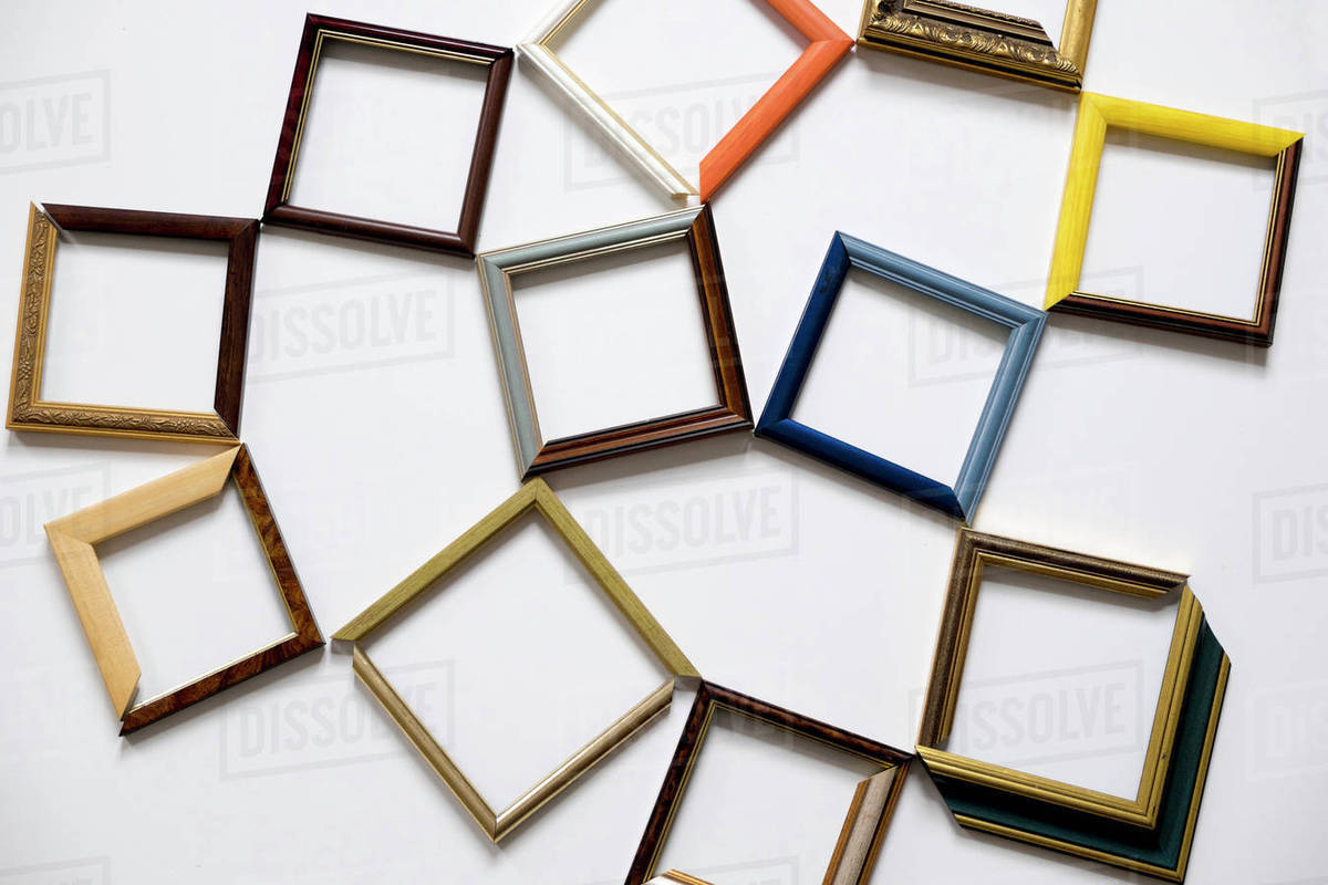Picture frames on white table Stock Photo Dissolve