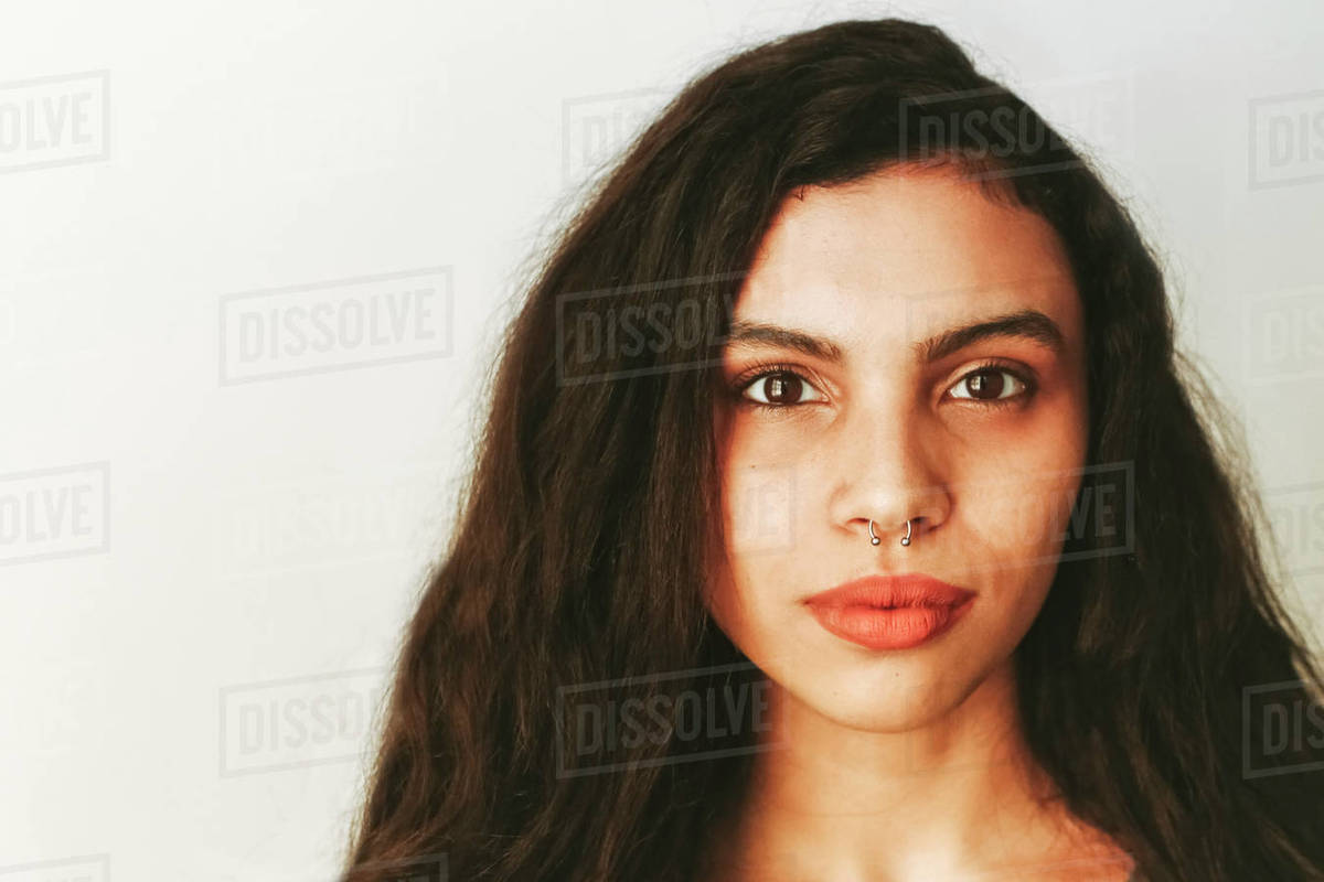 Portrait of mixed race woman with nose ring Stock Photo Dissolve