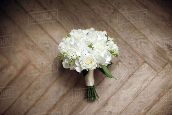 Bouquet of white roses on floor - Royalty-free Stock Photo | Dissolve