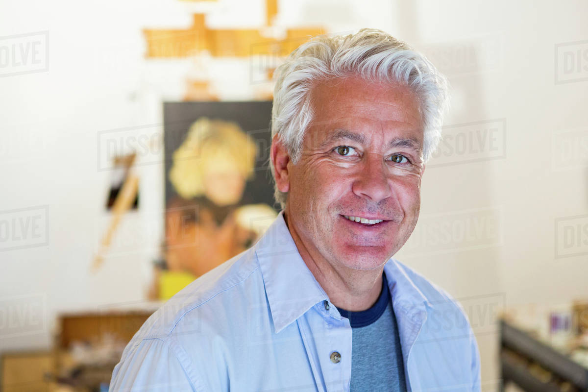 Older Hispanic Artist Smiling In Studio Stock Photo Dissolve older-hispanic-artist-smiling-in-studio-stock-photo-dissolve