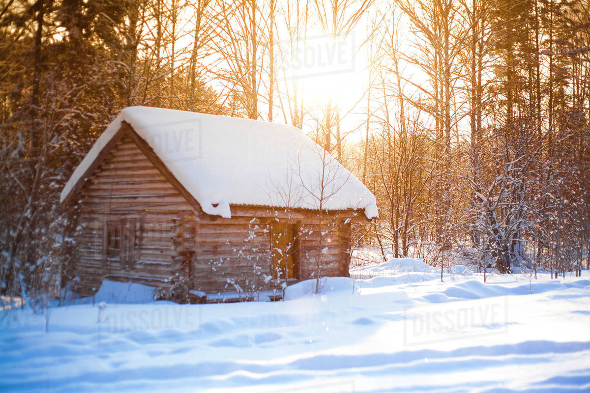 Log Cabin In Clearing In Snowy Forest Stock Photo Dissolve