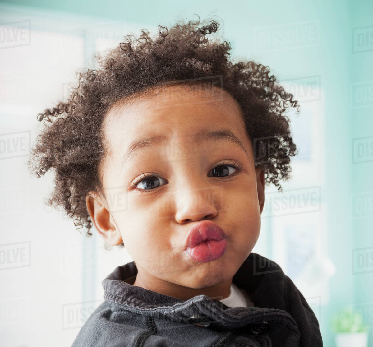 Close Up Of Mixed Race Boy S Face Stock Photo Dissolve