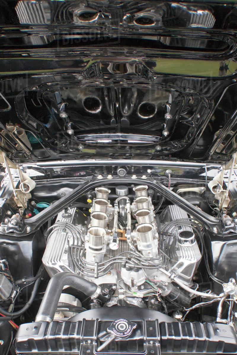 Racing car engine under the open hood Stock Photo Dissolve