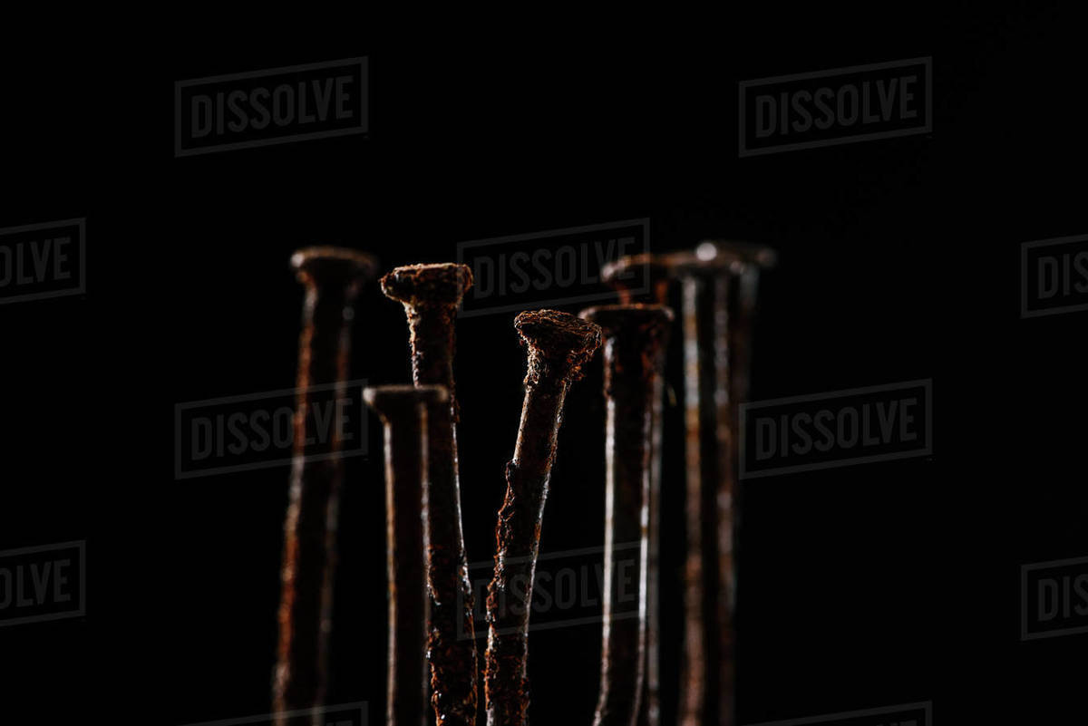 Close up view of vintage rusty nails isolated on black Stock Photo