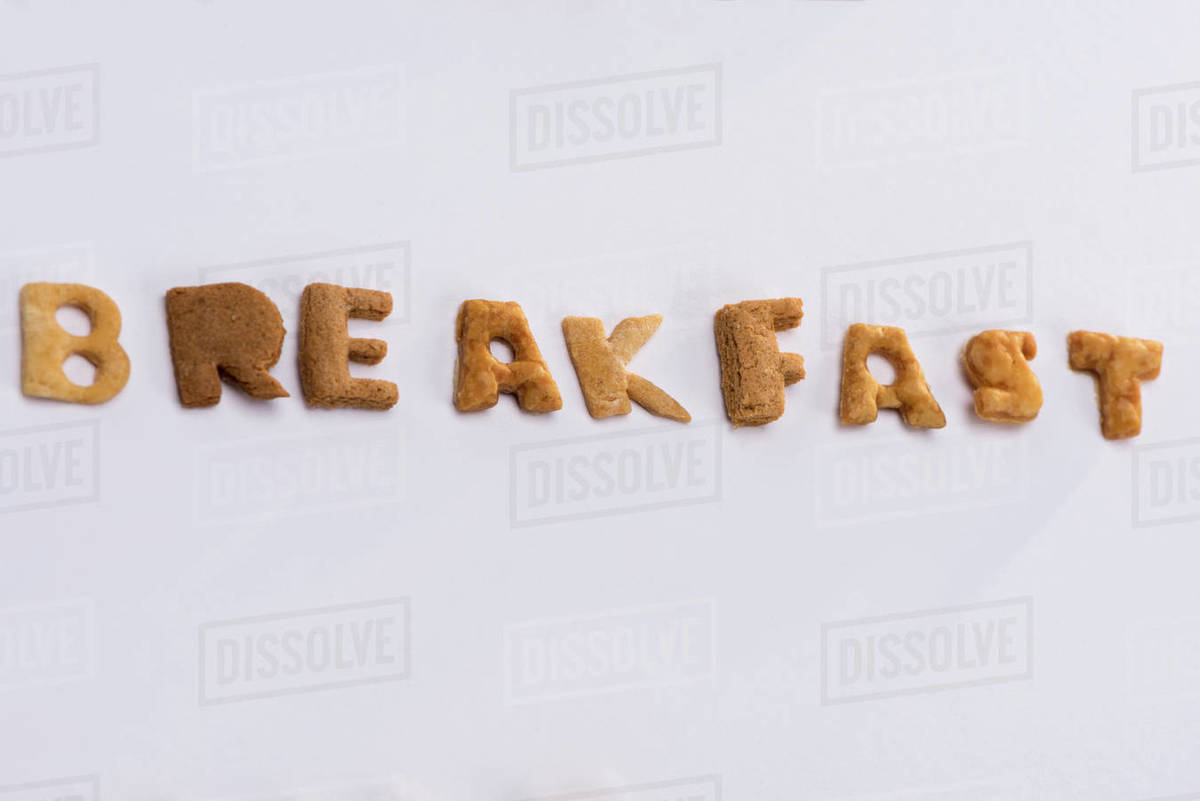 Closeup view of word breakfast from alphabet corn flakes isolated on