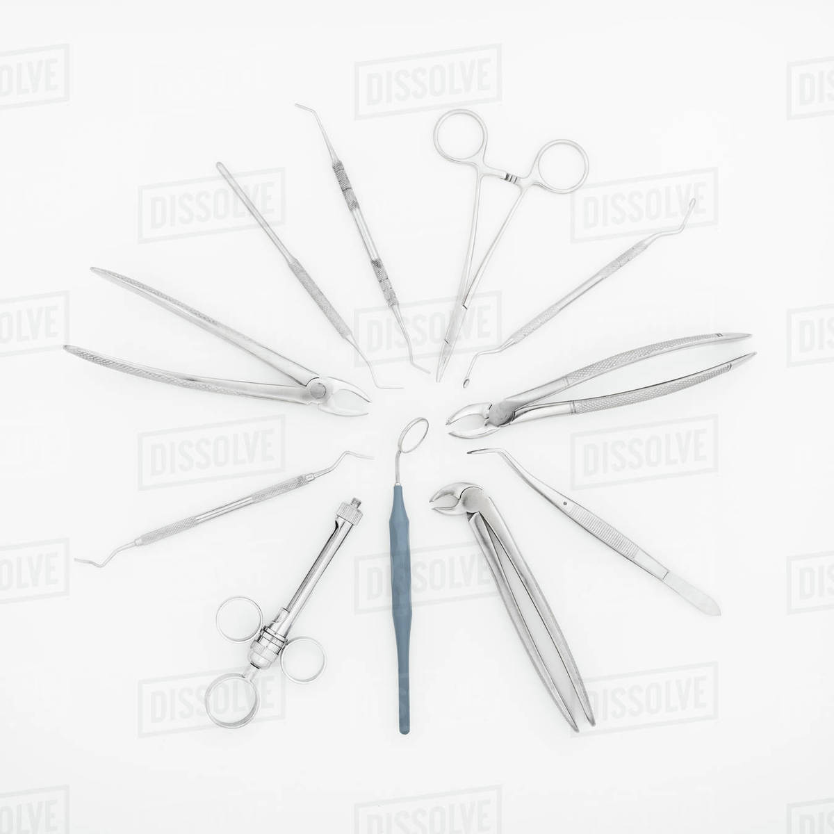 Top view of set of professional dental instruments isolated on white