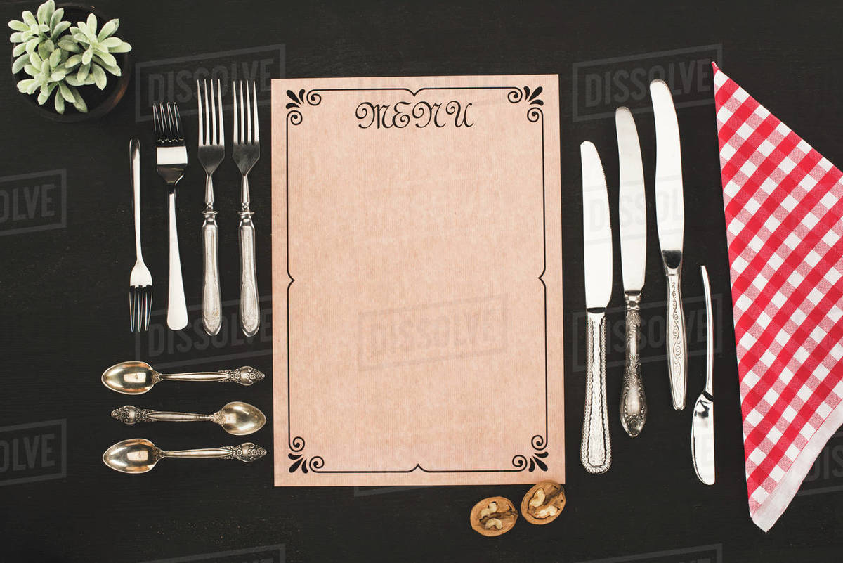 Top view of decorative blank menu and vintage cutlery on black - Stock ...