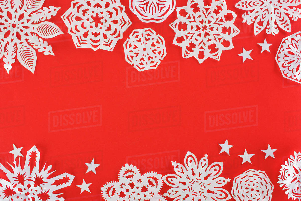 Christmas Background With White Paper Snowflakes Isolated On Red With Copy Space Stock Photo Dissolve