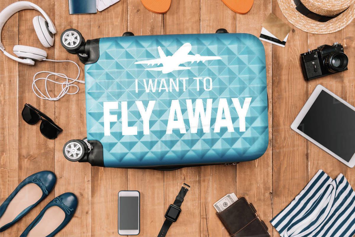 Planning for trip set with travel bag, airplane inspiration and