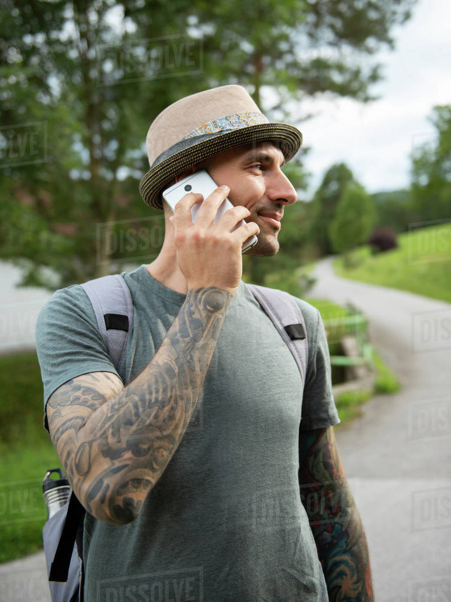 Man standing and talking by cell phone outdoor Royalty-free stock photo