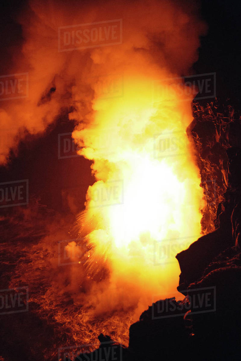 Closeup Lava flowing from a lava tube into Pacific ocean, Hawaii