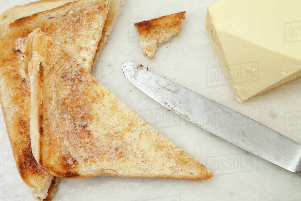 Slices Of Toast And Butter Stock Photo Dissolve