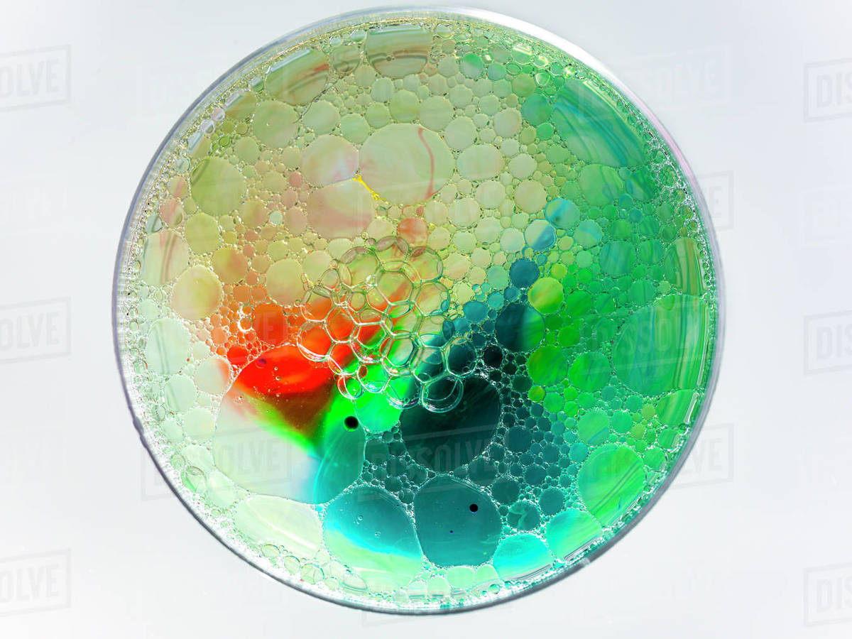 Soap bubbles and acrylic paint in oil Stock Photo Dissolve
