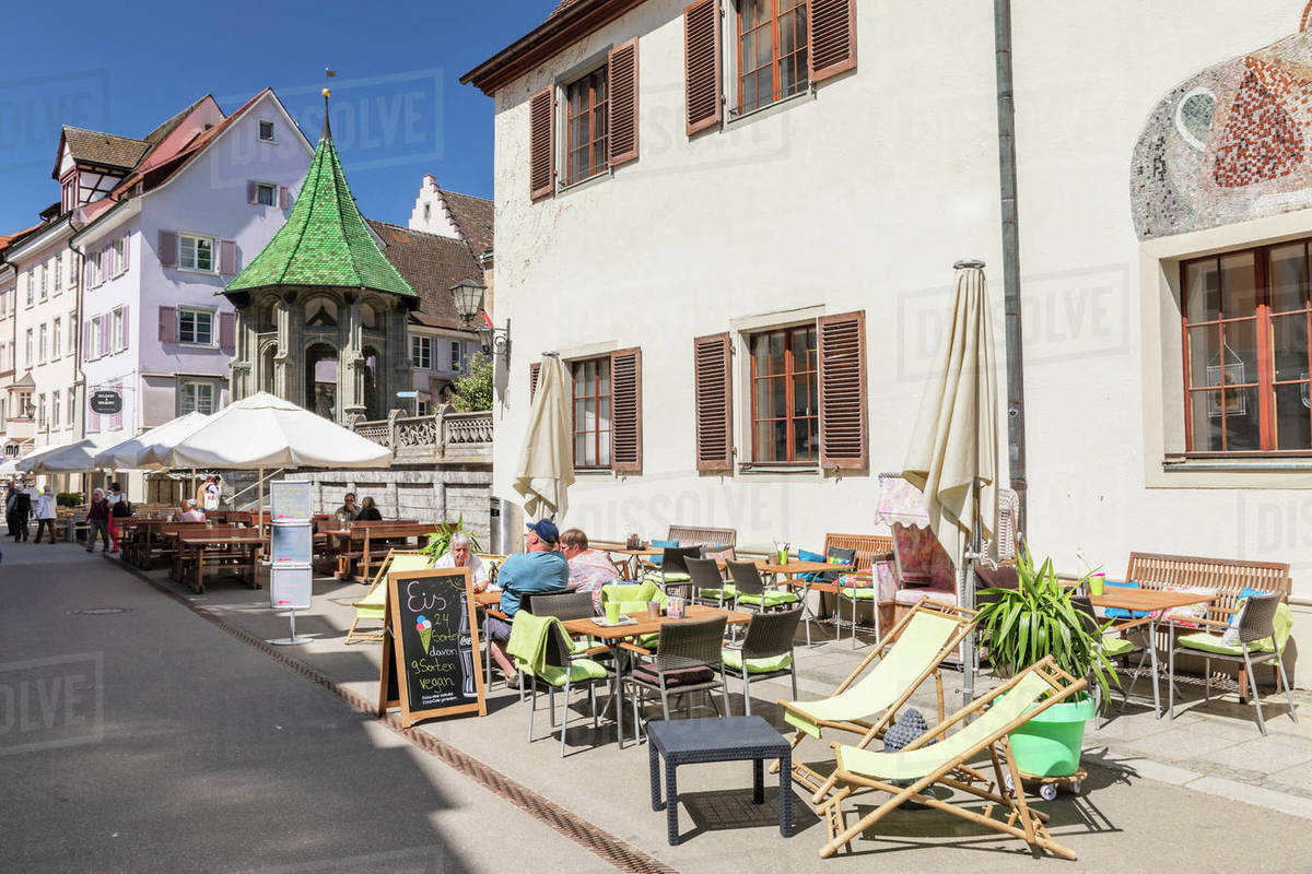 Street cafe on pedestrian area Munsterstrasse, Oelbergkapelle Chapel in the back, Uberlingen, Lake Constance, Baden-Wurttemberg, Germany, Europe Royalty-free stock photo