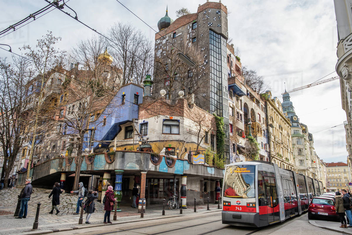 Tram at Hundertwasserhaus, expressionist landmark and public housing, designed by Friedenreich Hundertwasser in Vienna, Austria, Europe Royalty-free stock photo