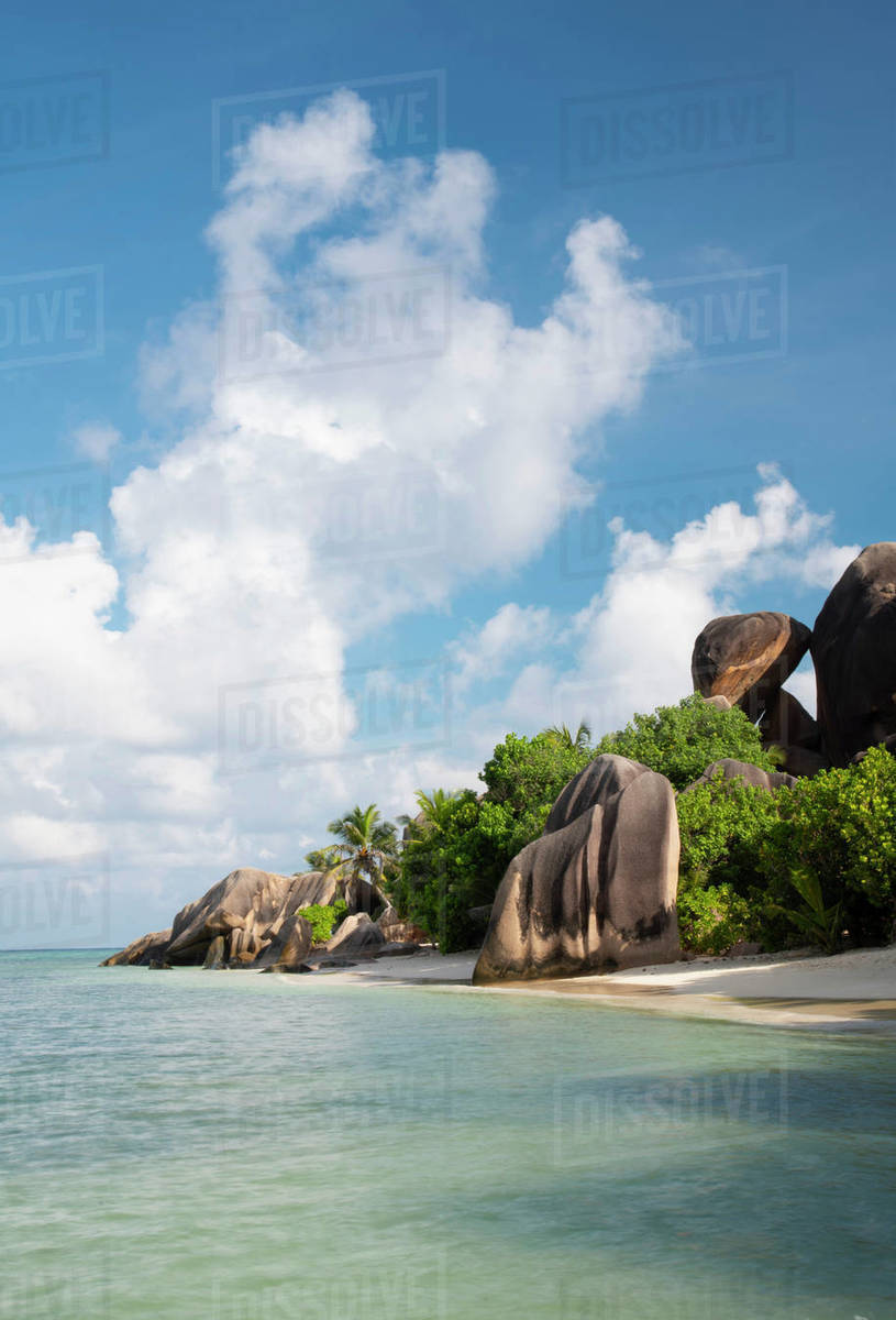 Distinctive large granite boulders and palm trees on Anse Source d'Argent, La Digue, Seychelles, Indian Ocean, Africa Royalty-free stock photo