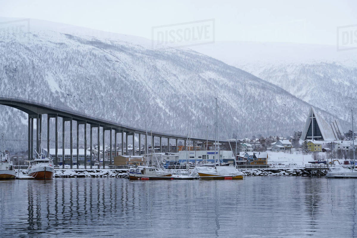 Tromso Harbour, the Bruvegen Bridge and Tromsdalen Church (Arctic Cathedral), Tromso, Troms County, Norway, Scandinavia, Europe Royalty-free stock photo